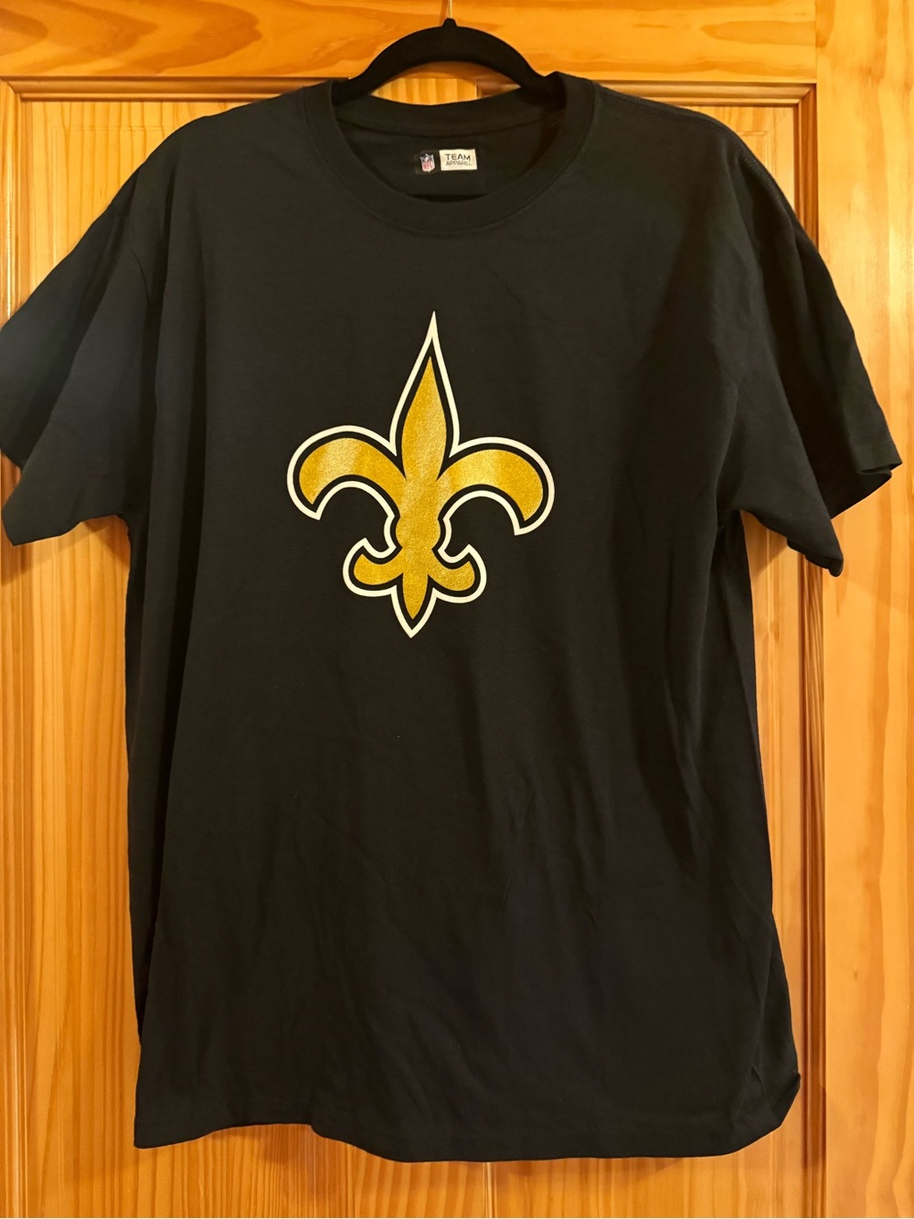 NFL Black T‑Shirt with Gold Fleur‑de‑Lis Graphic